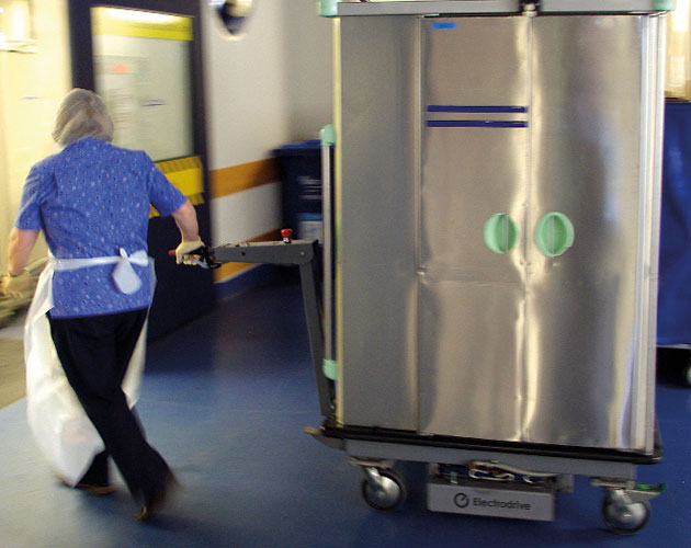Transpak towing a meal delivery unit in a hospital