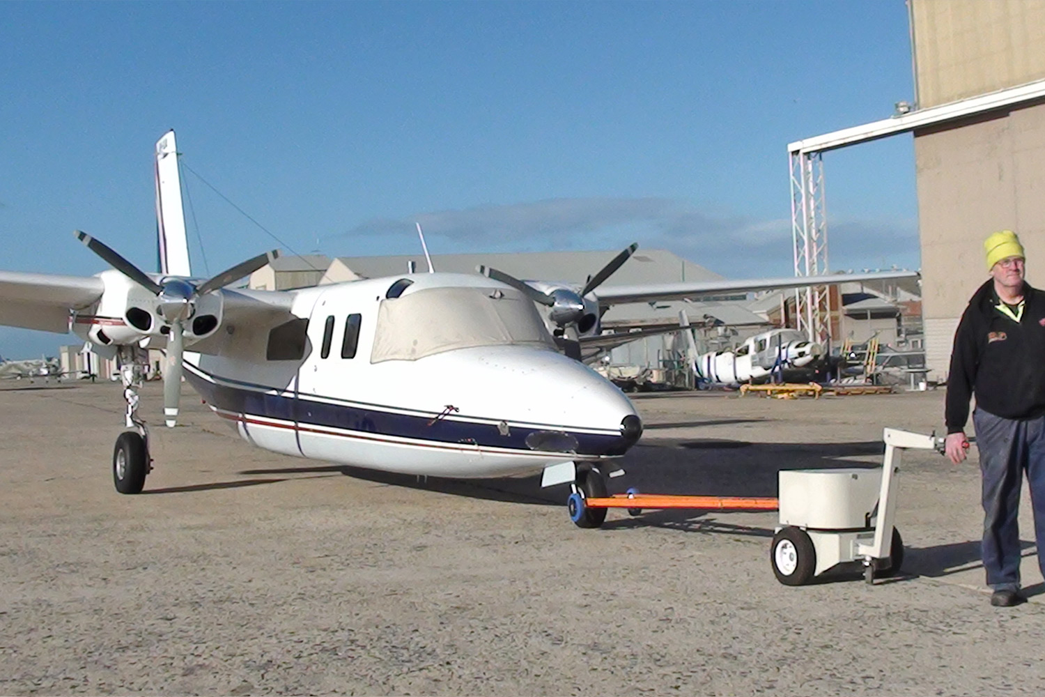Electrodrive's Tug Classic towing a light plane
