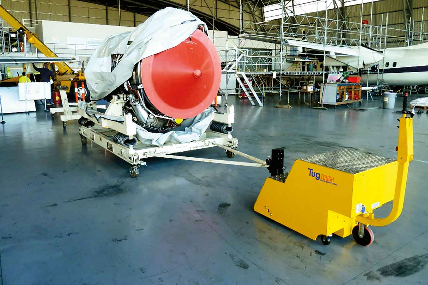 A Tug Tough towing aircraft machinery